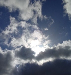 Sun breaking through a clouded sky in Bakersfield, CA